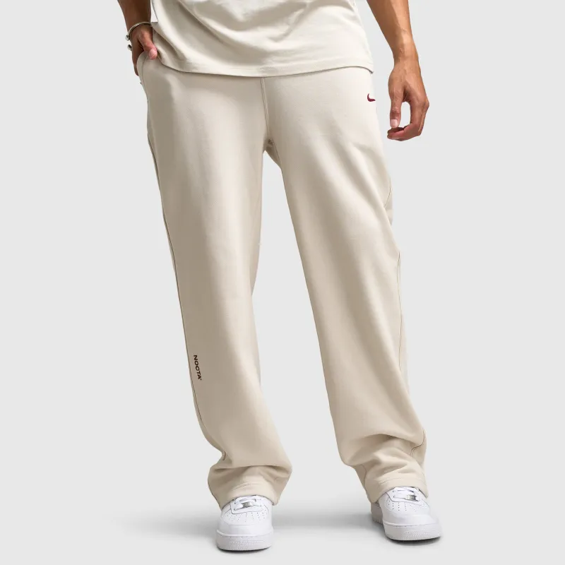 Nike Nocta NRG Fleece Open Hem Sweatpants Light Orewood Brown / Team Red sold by JD Sports