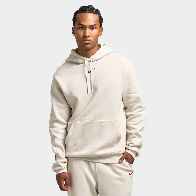 Nike NOCTA Fleece CS Pullover Hoodie Light Orewood Brown / Team Red sold by JD Sports