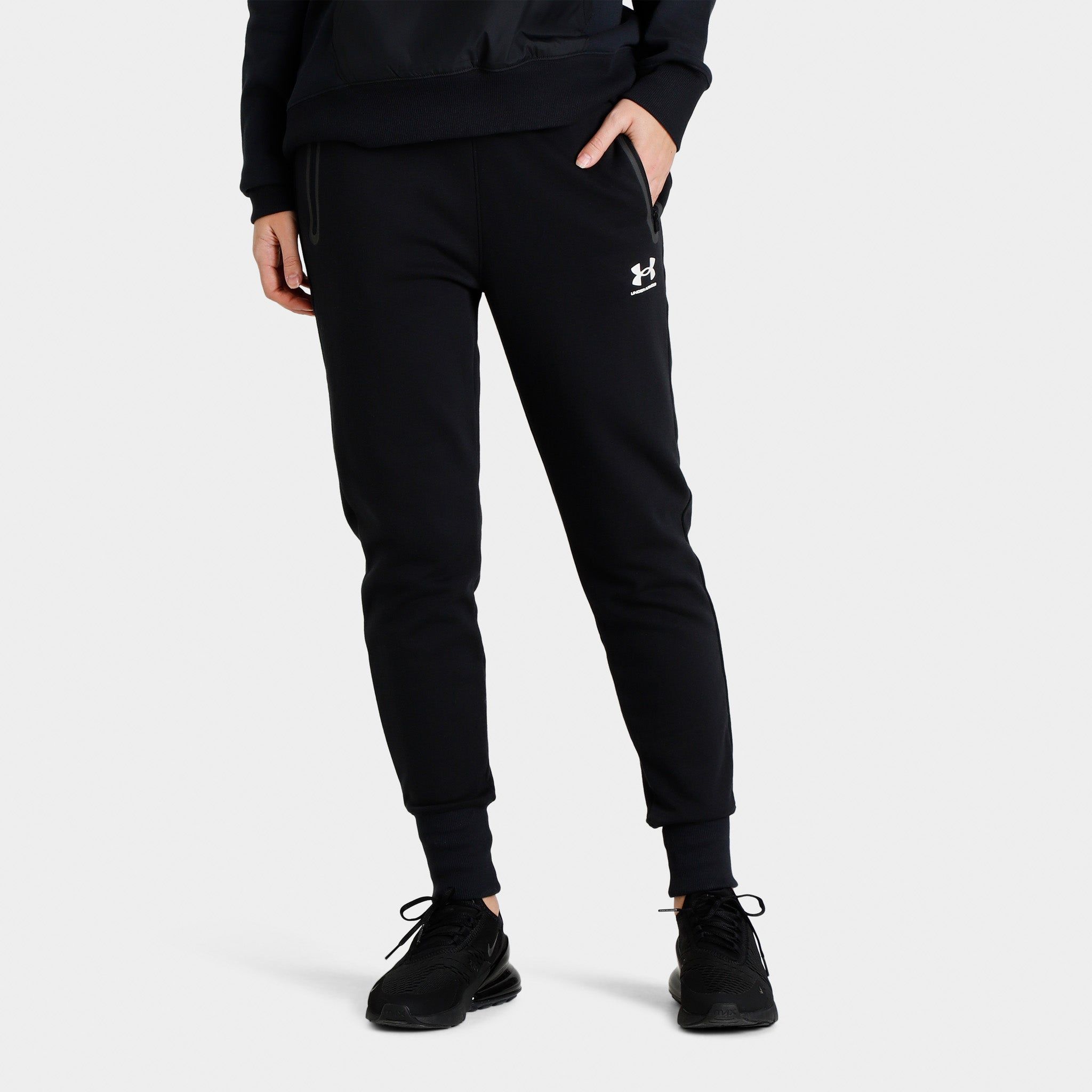 Under Armour Women’s Rival Fleece Track Pants Black / White sold by JD Sports