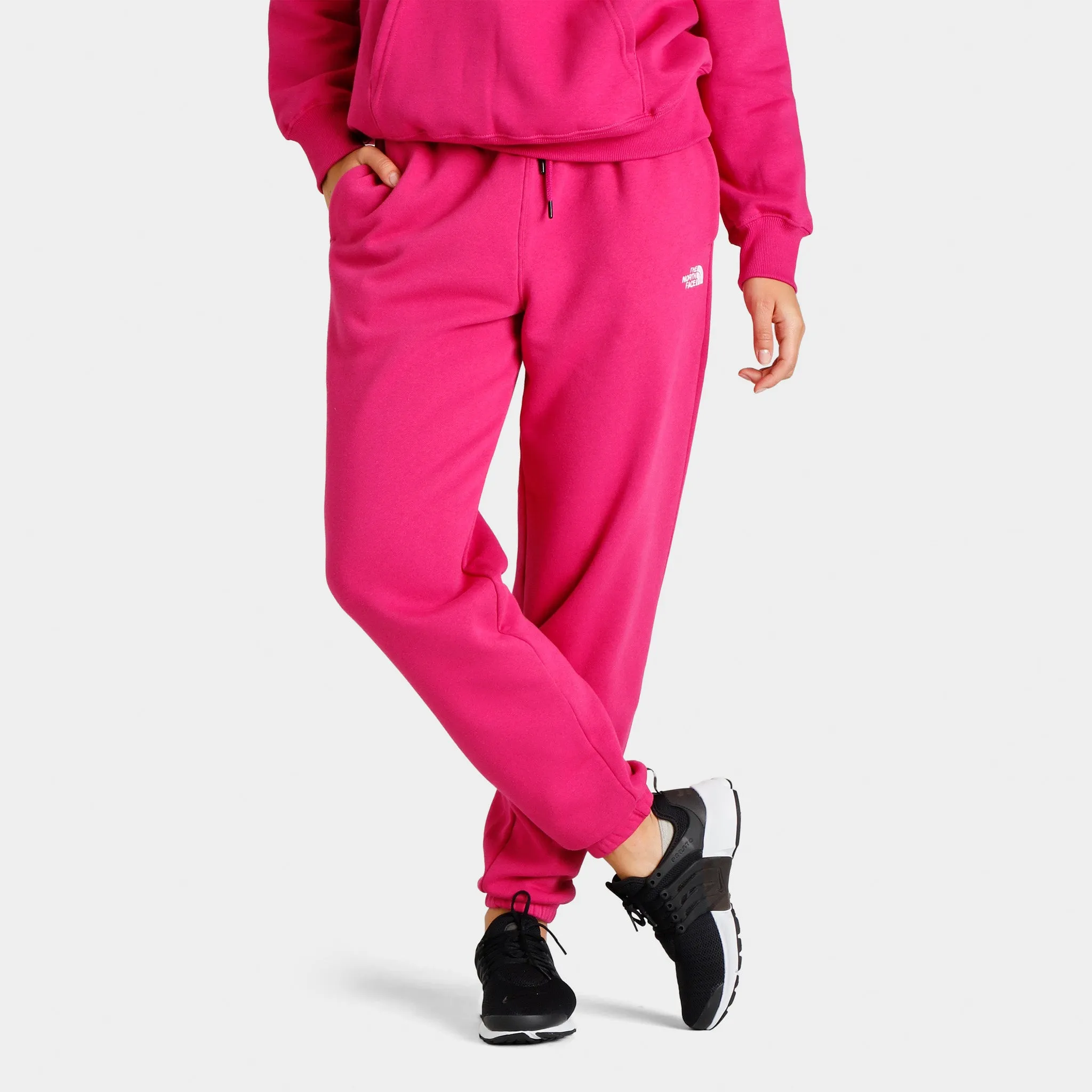 The North Face Women's Half Dome Fleece Sweatpants Fuschia Pink / TNF White sold by JD Sports