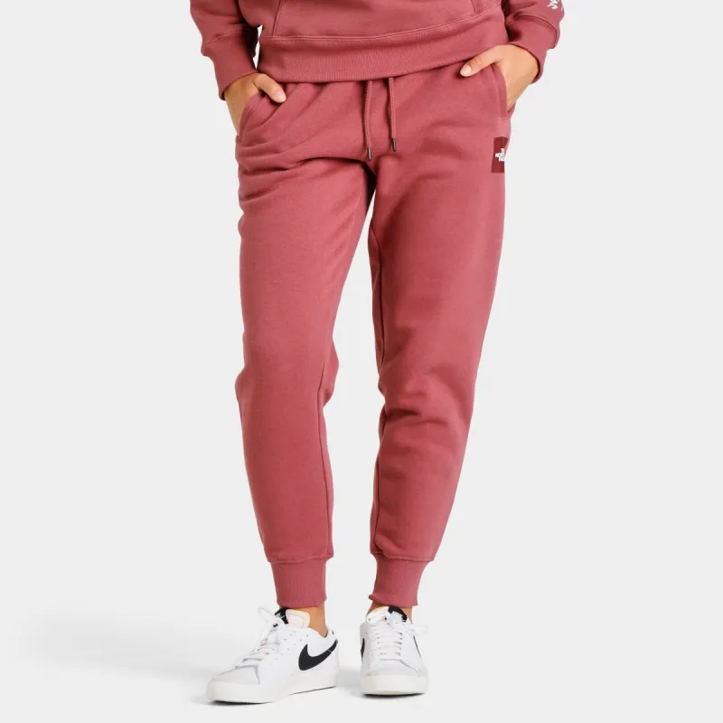 The North Face Women's Box NSE Joggers Wild Ginger / TNF White sold by JD Sports