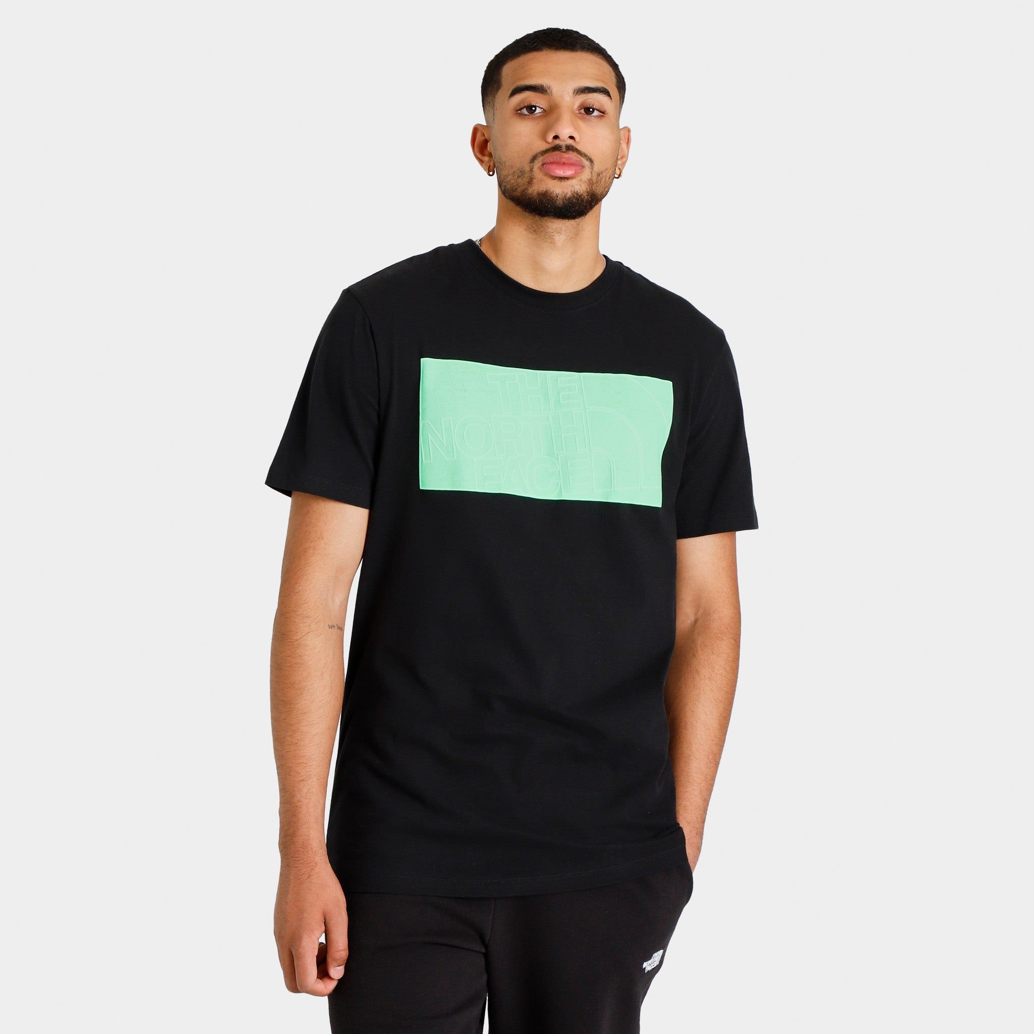 The North Face Graphic Injection T-shirt TNF Black / Chlorophyll Green sold by JD Sports