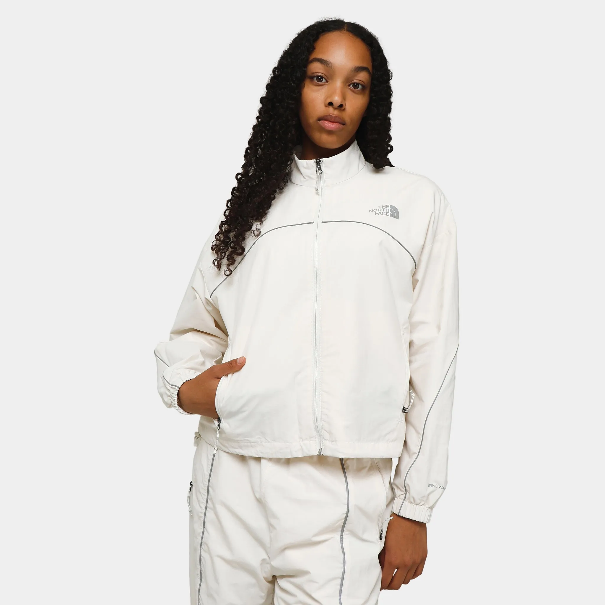 The North Face Women's Tek Piping Wind Jacket / Gardenia White sold by JD Sports