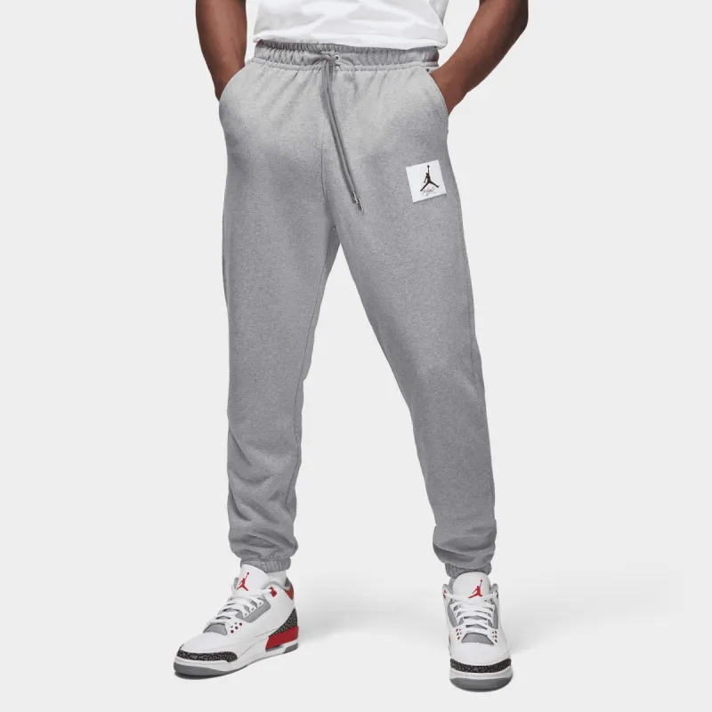 Jordan Essentials Fleece Pants Carbon Heather / Sail sold by JD Sports