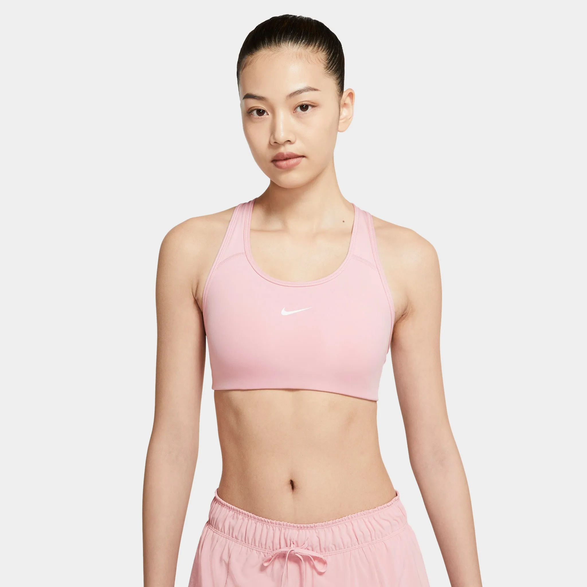 Nike Women's Dri-FIT Swoosh Medium-Support 1-Piece Pad Sports Bra / Pink Glaze sold by JD Sports