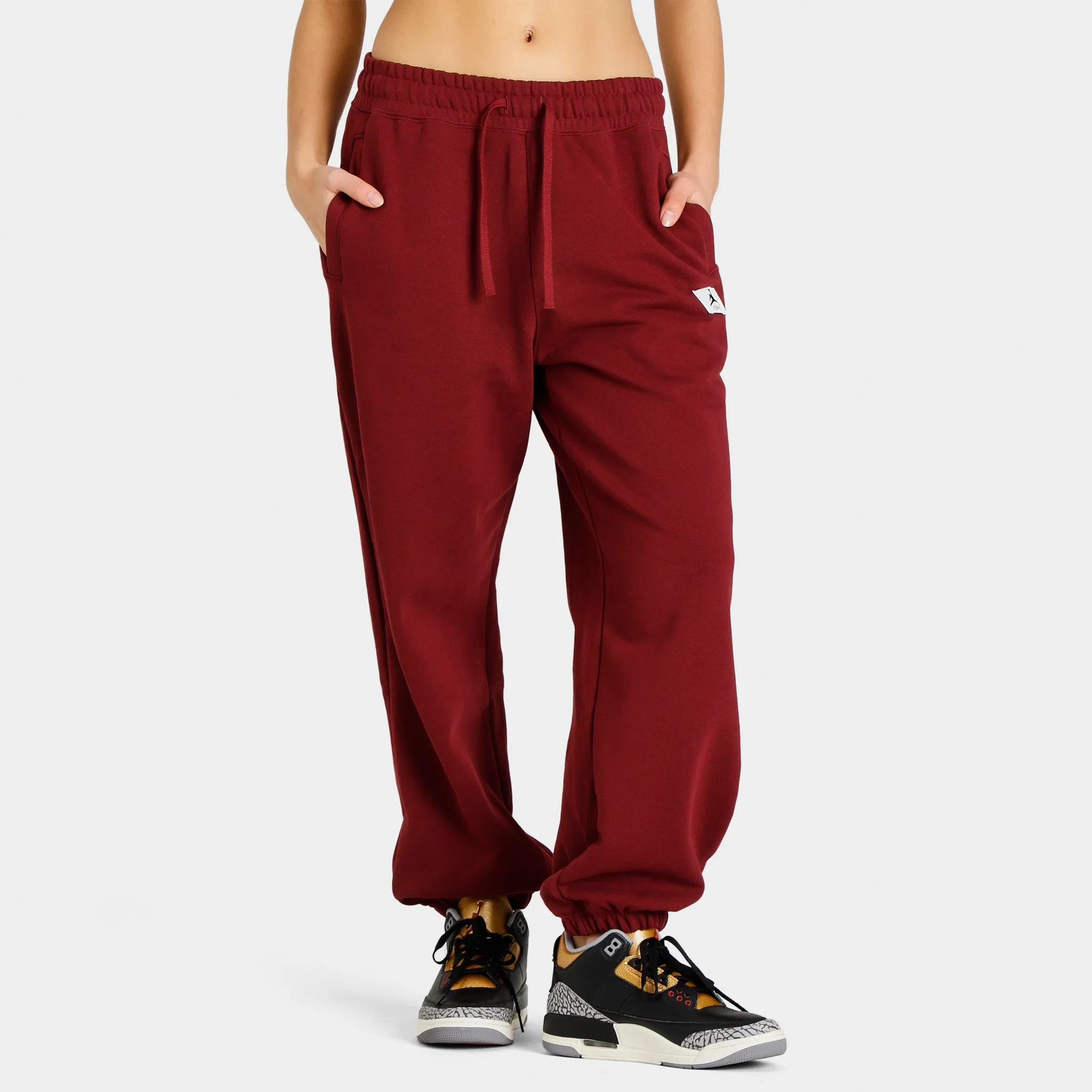 Jordan Women's Flight Fleece Pants / Cherrywood Red sold by JD Sports