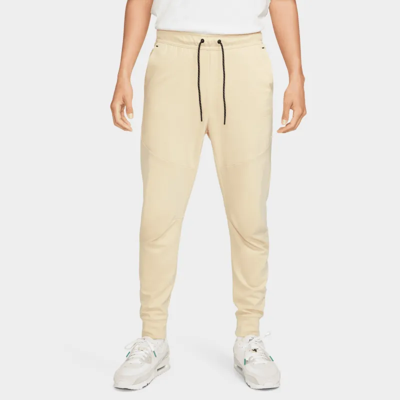 Nike Tech Fleece Lightweight Slim Fit Joggers / Team Gold sold by JD Sports