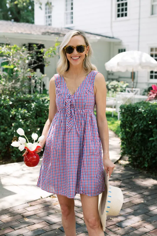 The Penelope Dress in Red & Navy Gingham sold by Duffield Lane