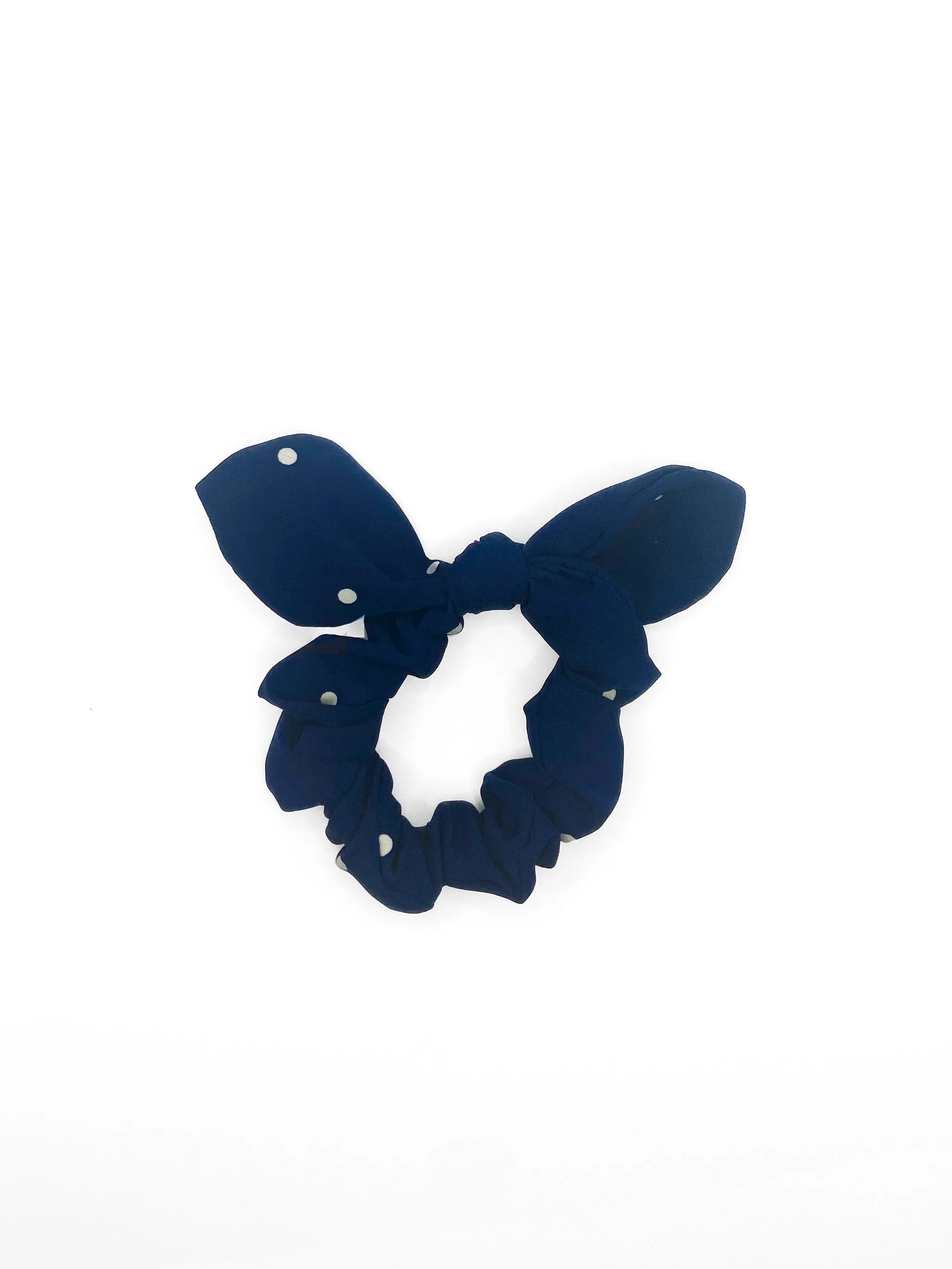 The Tay Bow Scrunchy - Navy Polkadots sold by Duffield Lane