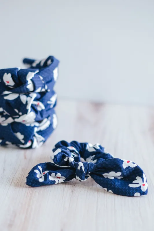 The Tay Bow Scrunchy - Navy/Red White Floral sold by Duffield Lane