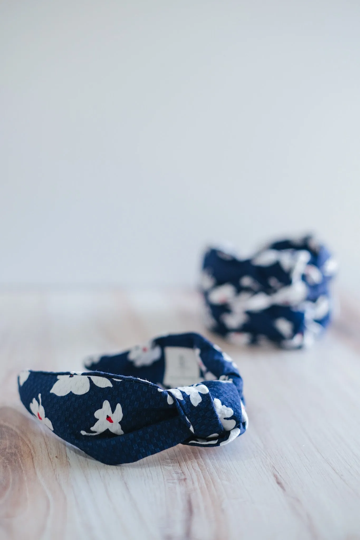 The Jones Headband - Navy/Red White Floral sold by Duffield Lane