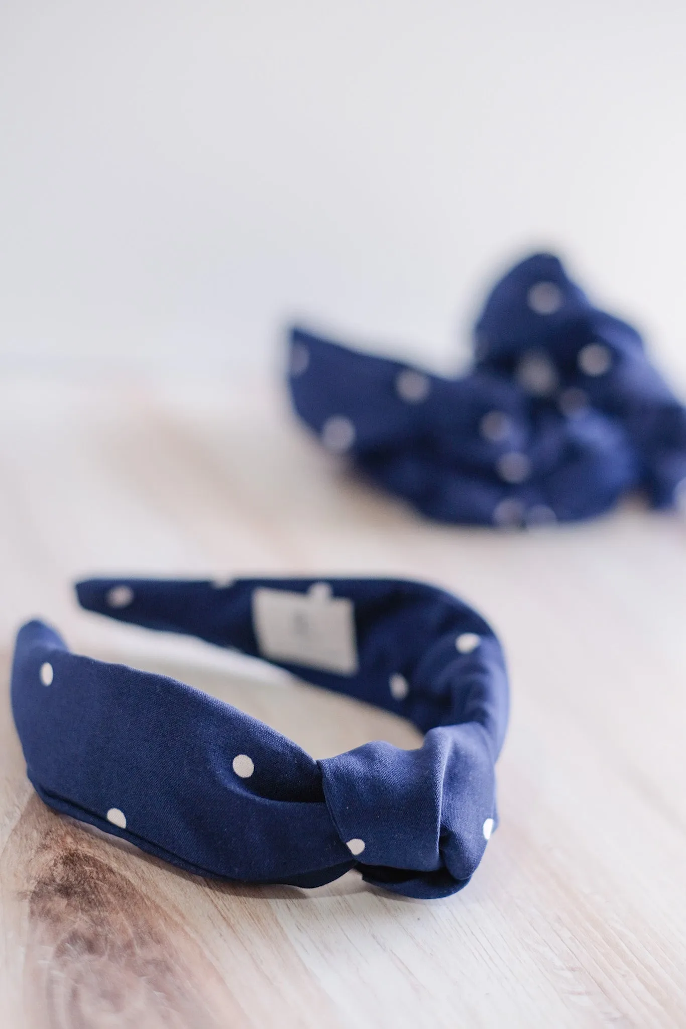 The Jones Headband - Navy Polkadot sold by Duffield Lane