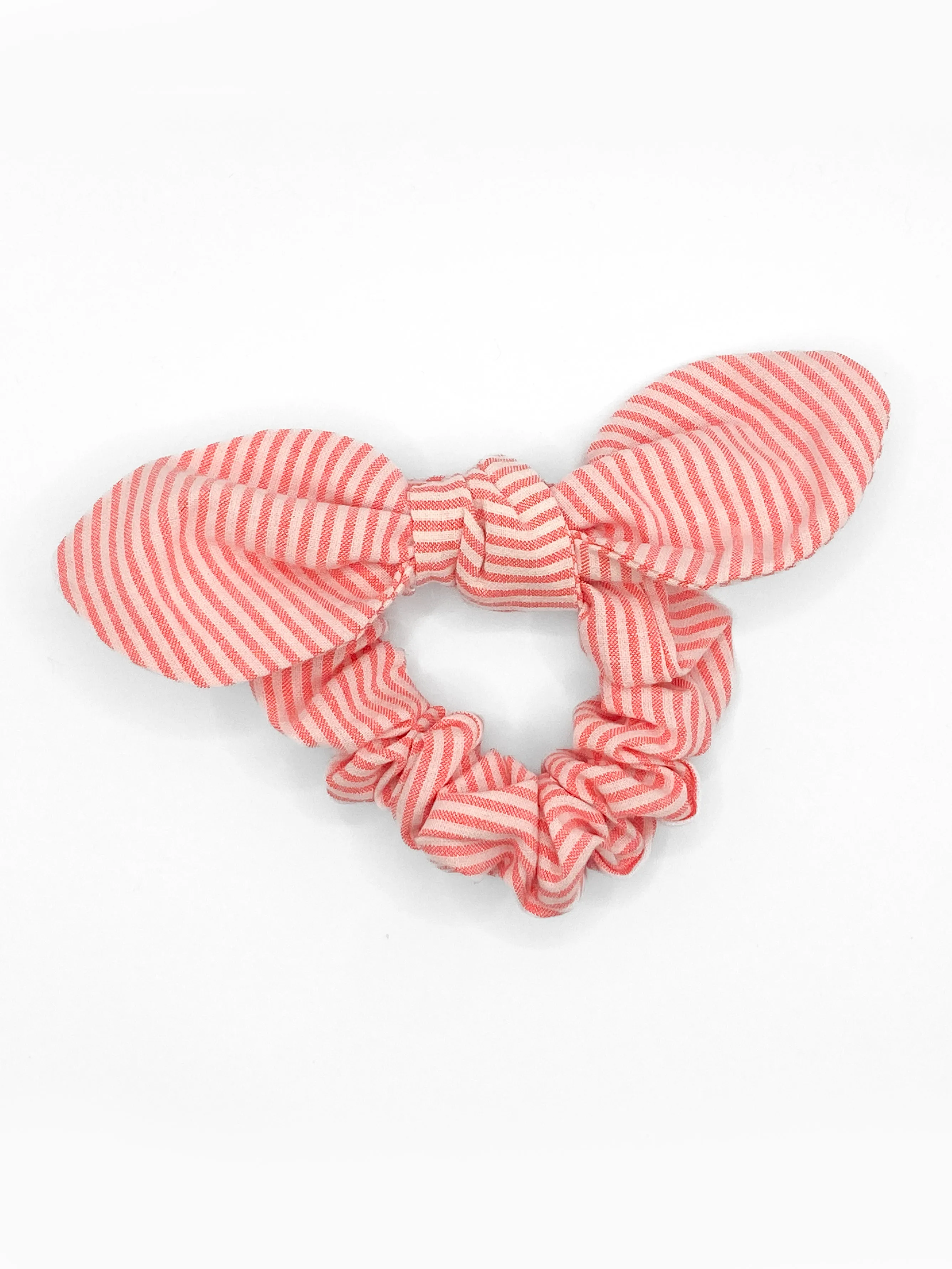 The Tay Bow Scrunchy - Neon Coral Seersucker sold by Duffield Lane