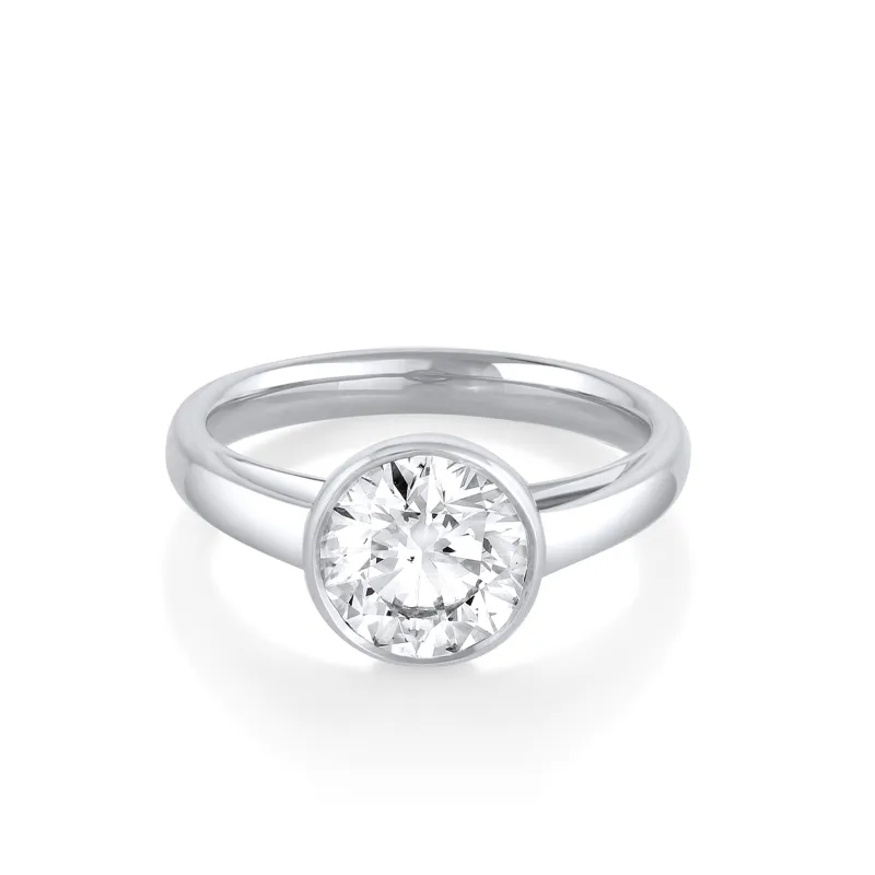 The Tessa Bezel Round Solitaire Engagement Ring sold by Marrow Fine