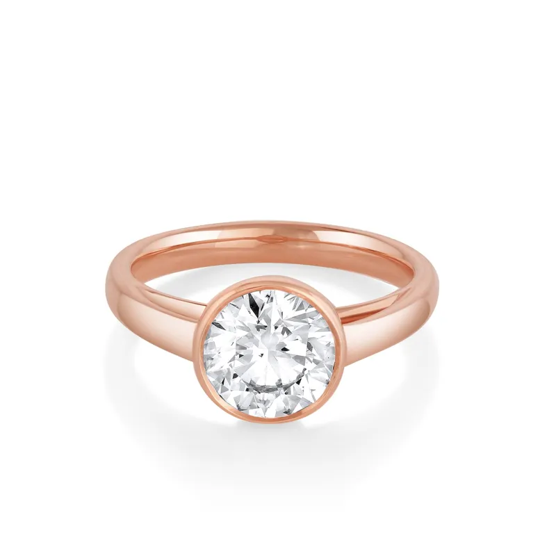 The Tessa Bezel Round Solitaire Engagement Ring sold by Marrow Fine
