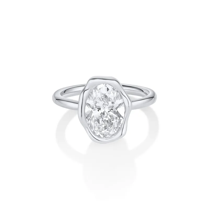 The Abstract Bezel Oval Engagement Ring sold by Marrow Fine