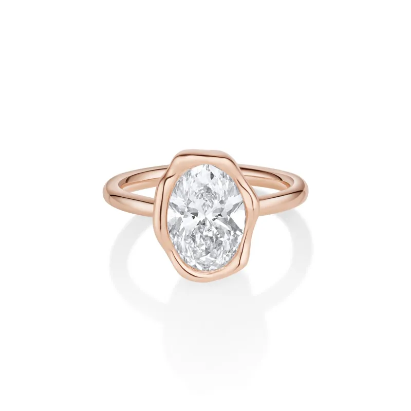 The Abstract Bezel Oval Engagement Ring sold by Marrow Fine