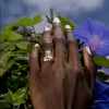 The Roxy Bezeled Emerald Cut Engagement Ring sold by Marrow Fine