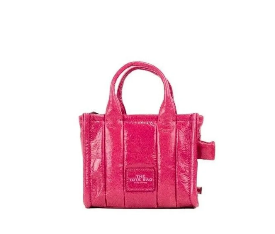 The Shiny Crinkle Micro Tote Magenta Leather Crossbody Bag Handbag sold by Louxly