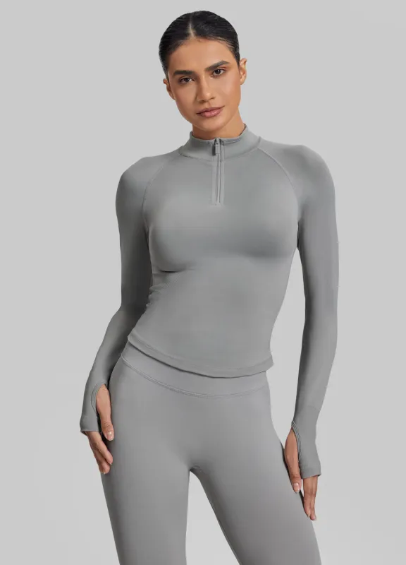 Ultrasculpt Longline Form-Fitting Seamless Thumb Hole Twill Knit Half-Zip Top sold by BetterMe