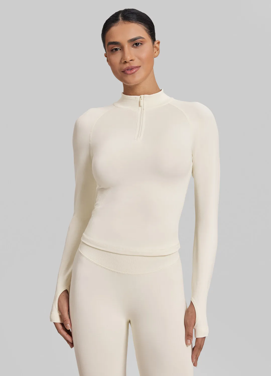Ultrasculpt Longline Form-Fitting Seamless Thumb Hole Twill Knit Half-Zip Top sold by BetterMe