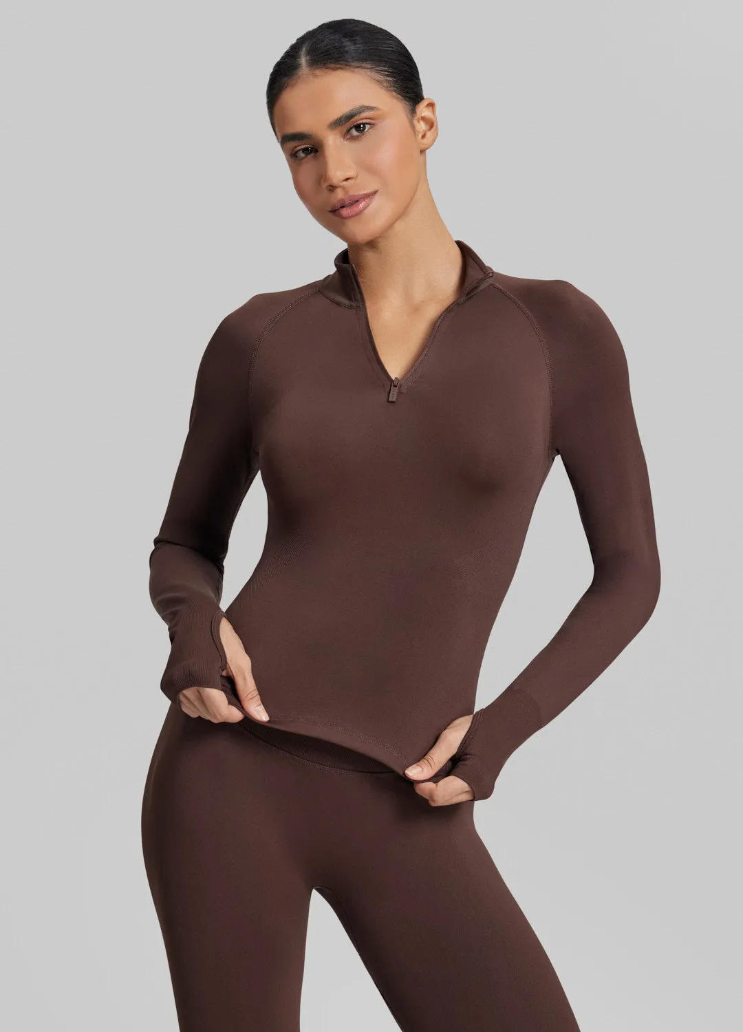 Ultrasculpt Longline Form-Fitting Seamless Thumb Hole Twill Knit Half-Zip Top sold by BetterMe