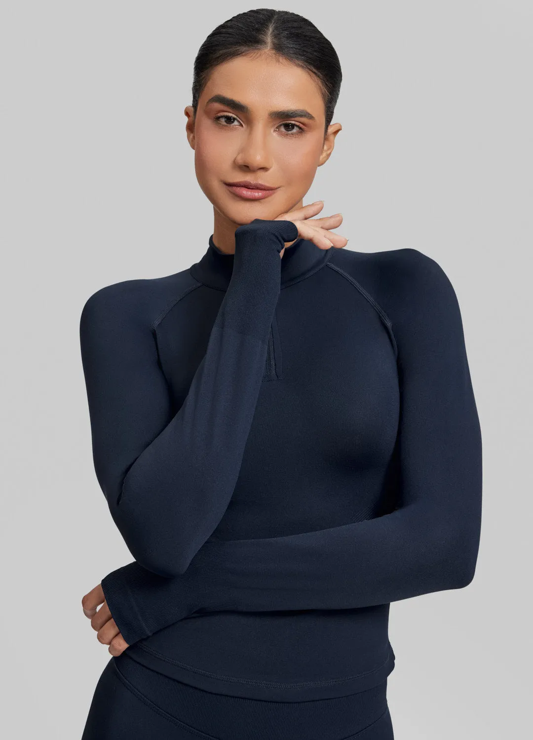 Ultrasculpt Longline Form-Fitting Seamless Thumb Hole Twill Knit Half-Zip Top sold by BetterMe