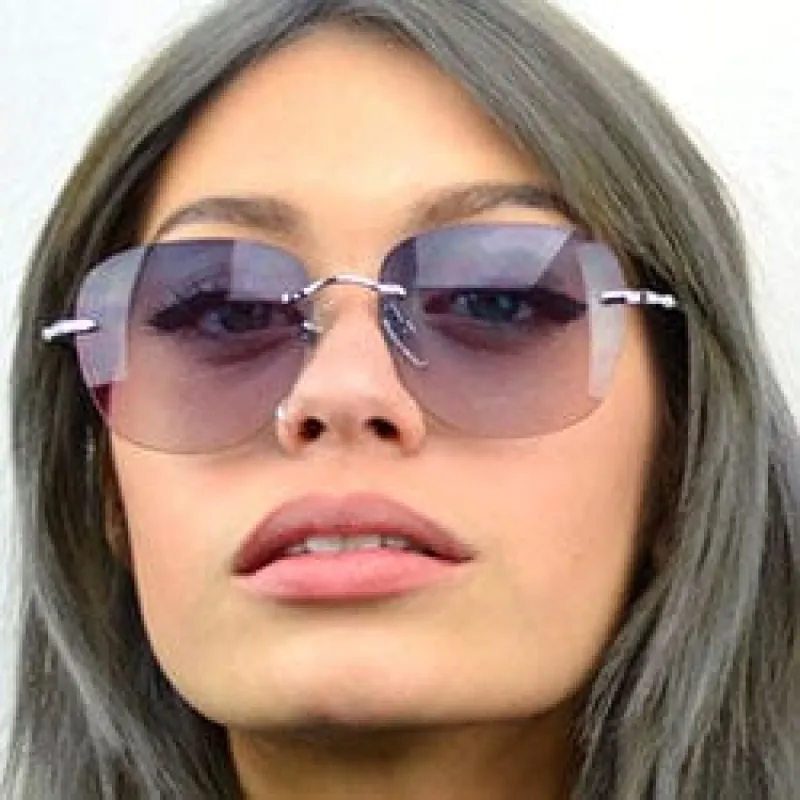 CELESTIAL Purple/Pink Rimless Sunglasses sold by Giant Vintage