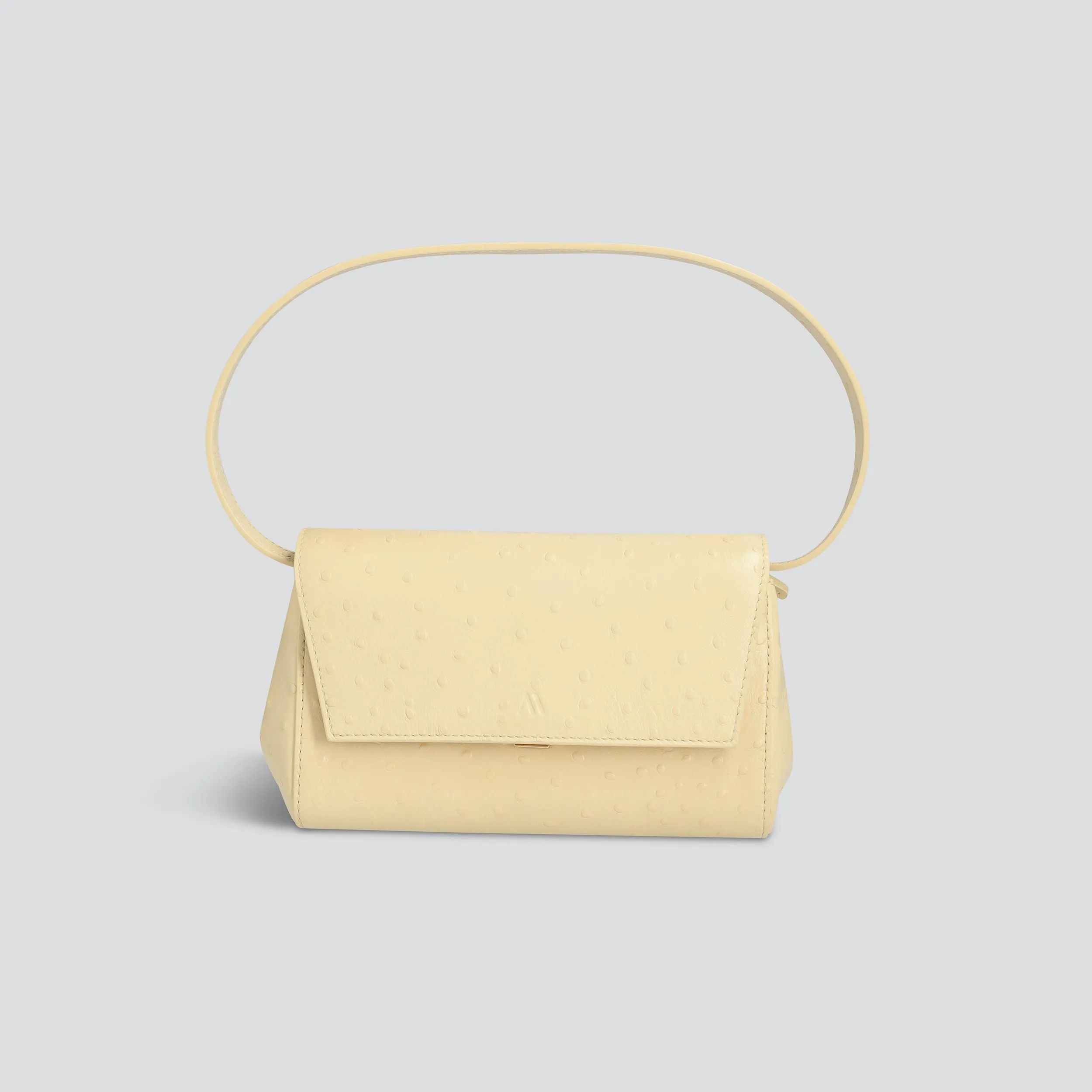 Ikon Clutch - ostrich butter yellow sold by Kaai nv