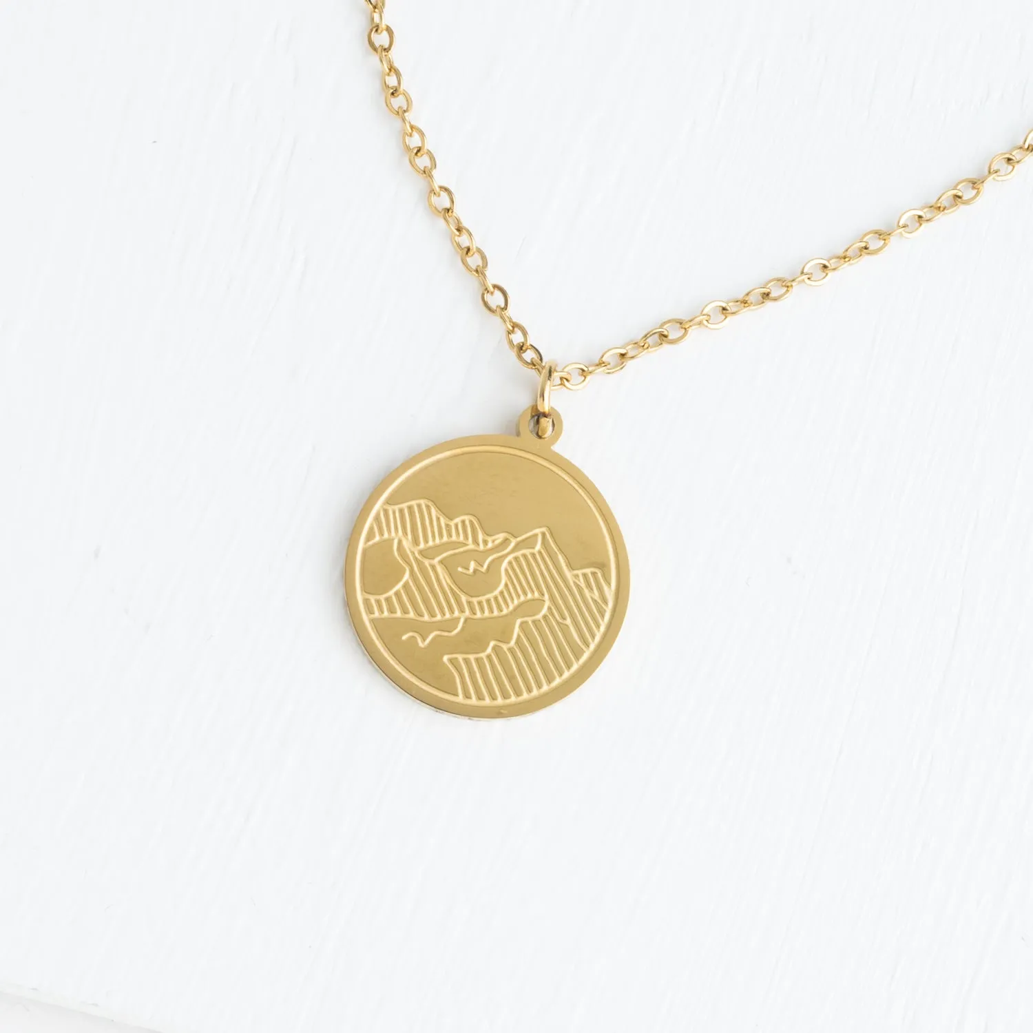 Mountain Adventure Necklace in Gold sold by Starfish Project