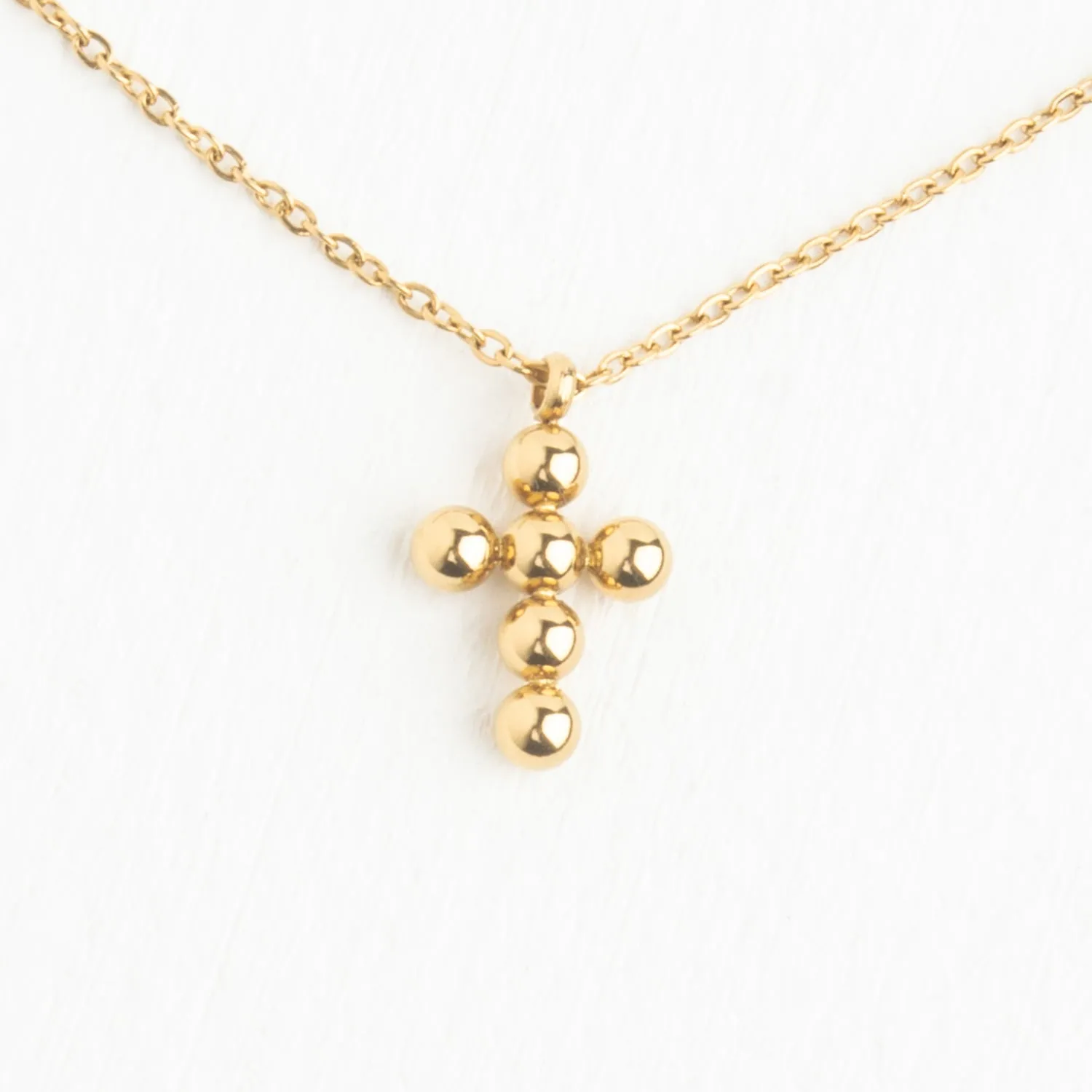 Perfect Harmony Gold Cross Necklace sold by Starfish Project