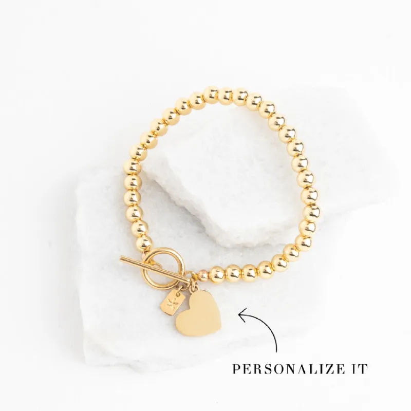 Engravable Heart Pendant on Handbeaded Gold Bracelet sold by Starfish Project