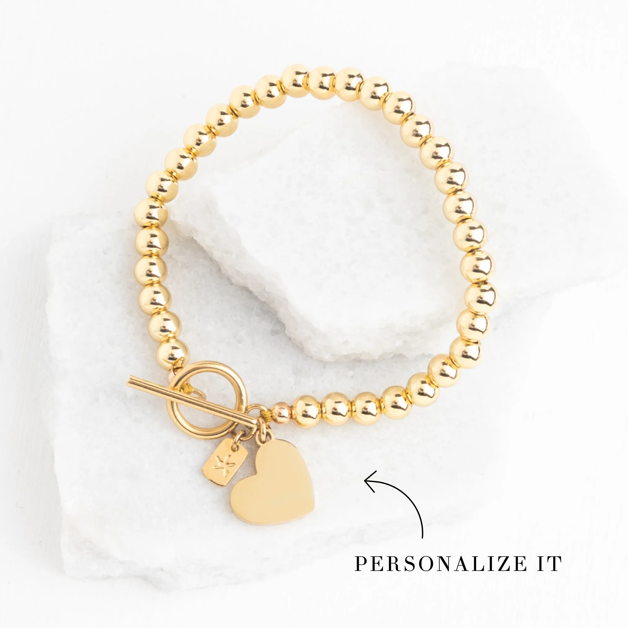 Engravable Heart Pendant on Handbeaded Gold Bracelet sold by Starfish Project