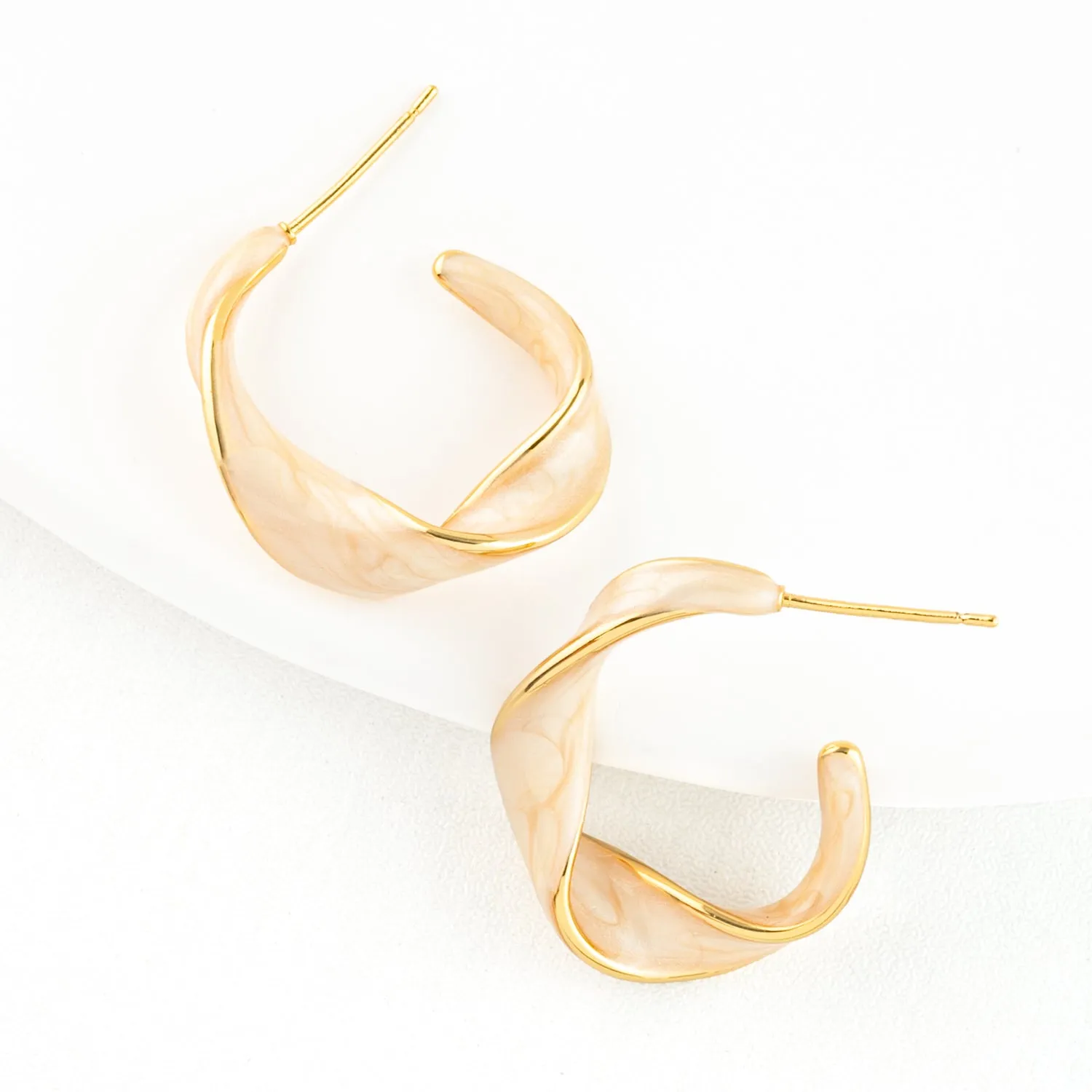 With a Twist Hoops in Soft Coral sold by Starfish Project