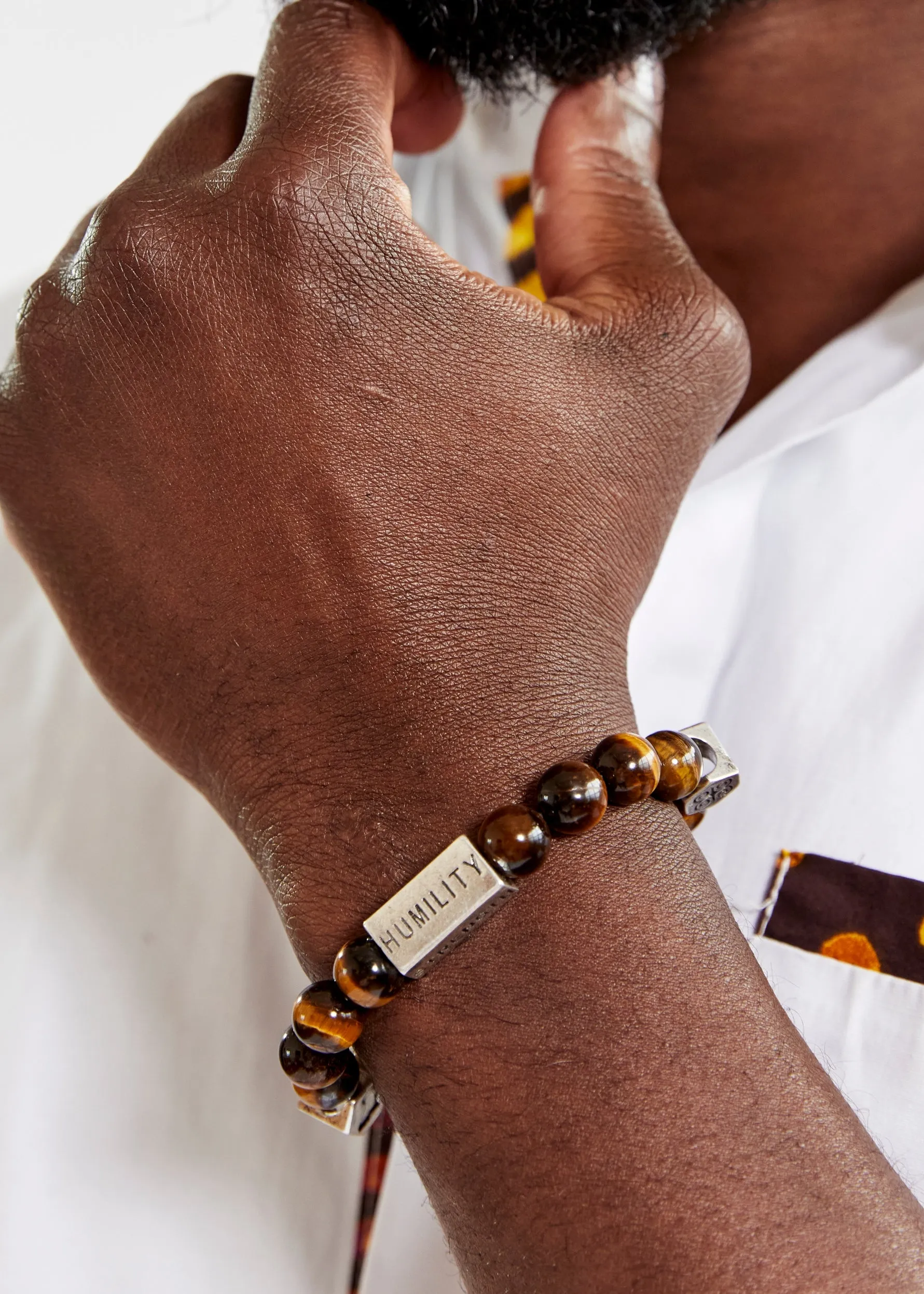 Irele Beaded Humility and Strength Adinkra Symbol Bracelet (Brown) sold by D'iyanu
