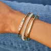 Gold Bangle with Diamond Detail sold by EF Collection