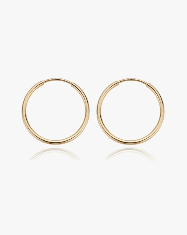 Large Thin Infinity Hoops sold by Midori Jewelry Co.