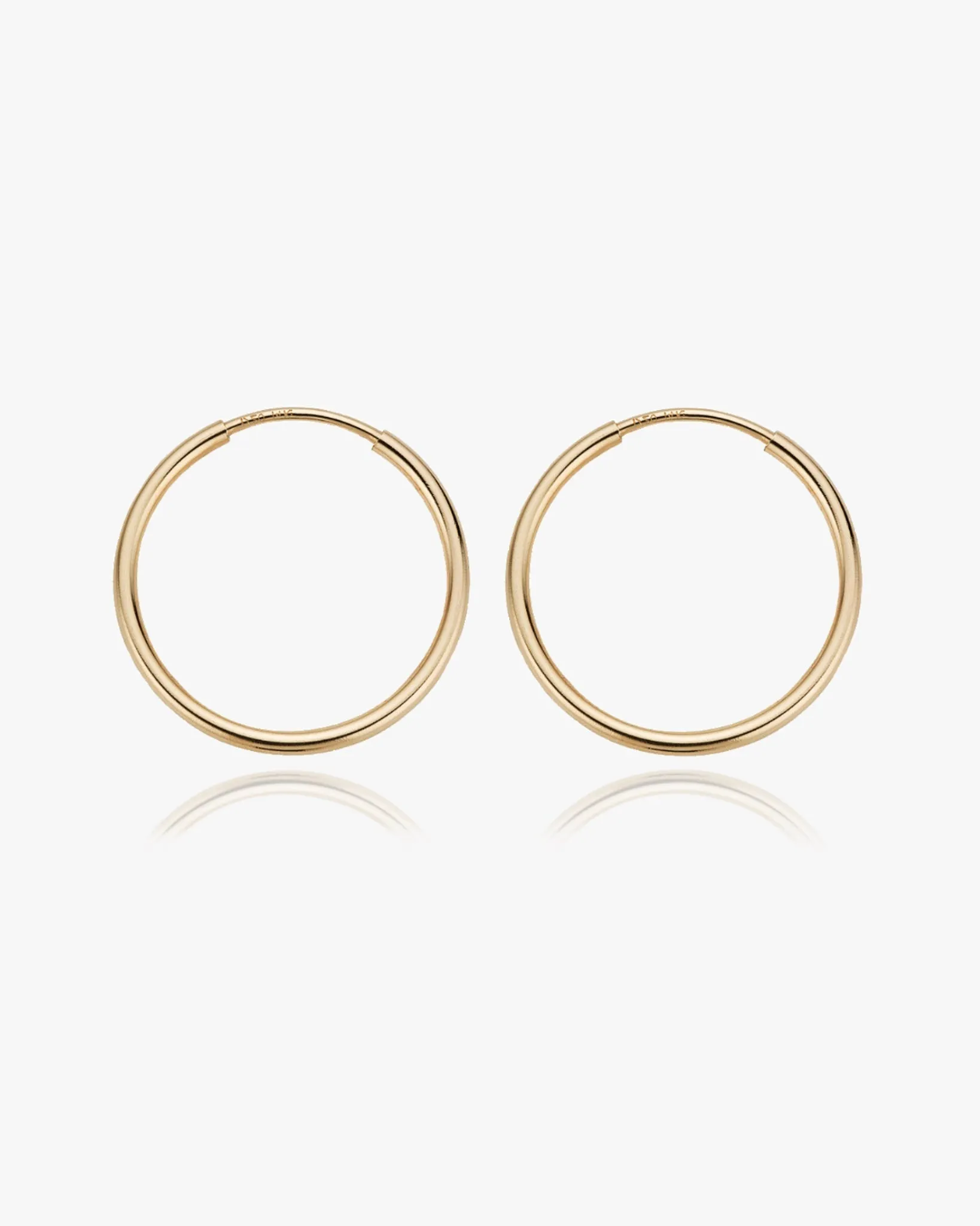 Large Thin Infinity Hoops sold by Midori Jewelry Co.