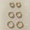 Large Thin Infinity Hoops sold by Midori Jewelry Co.