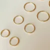 Large Thin Infinity Hoops sold by Midori Jewelry Co.