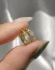 Nebula Opal Hoops in Vermeil sold by Midori Jewelry Co.
