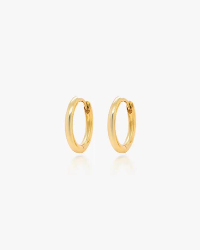 Mini Huggie Hoops sold by Midori Jewelry Co.