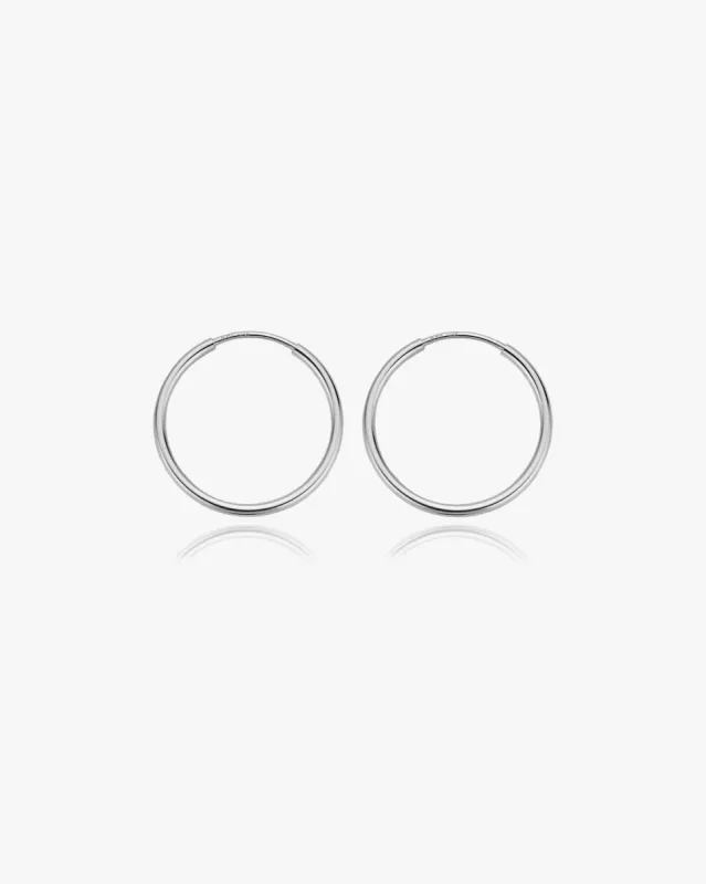 Medium Thin Infinity Hoops in Silver sold by Midori Jewelry Co.