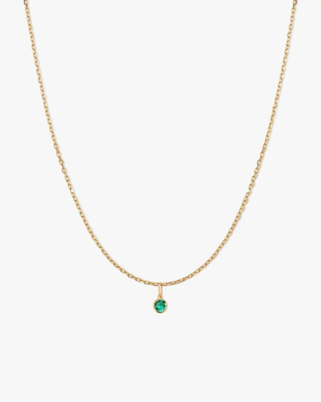 Round Emerald Charm Necklace in 14k Gold sold by Midori Jewelry Co.