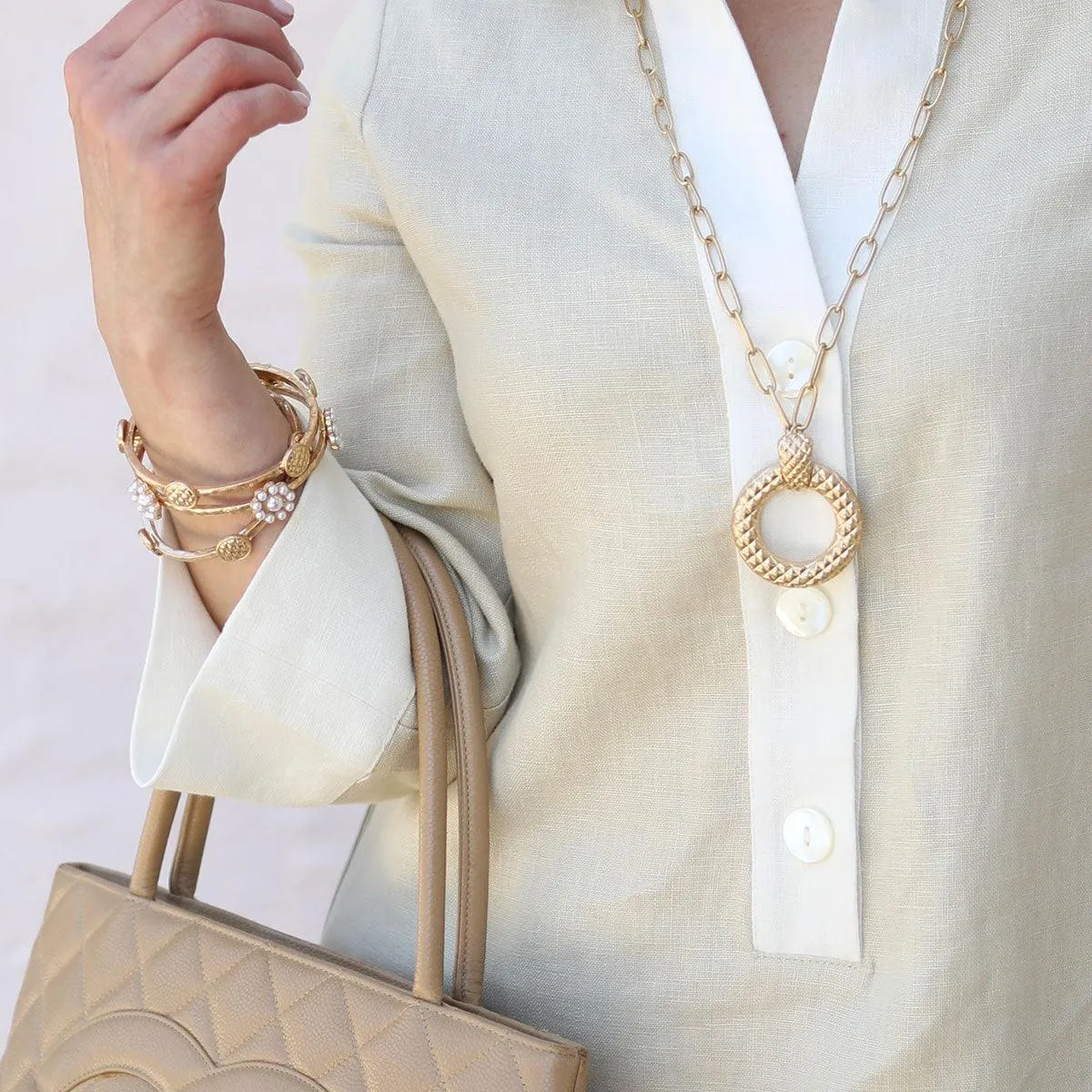 Claudia Quilted Metal Disc Bangle in Worn Gold sold by Canvas Style product image thumbnail 2