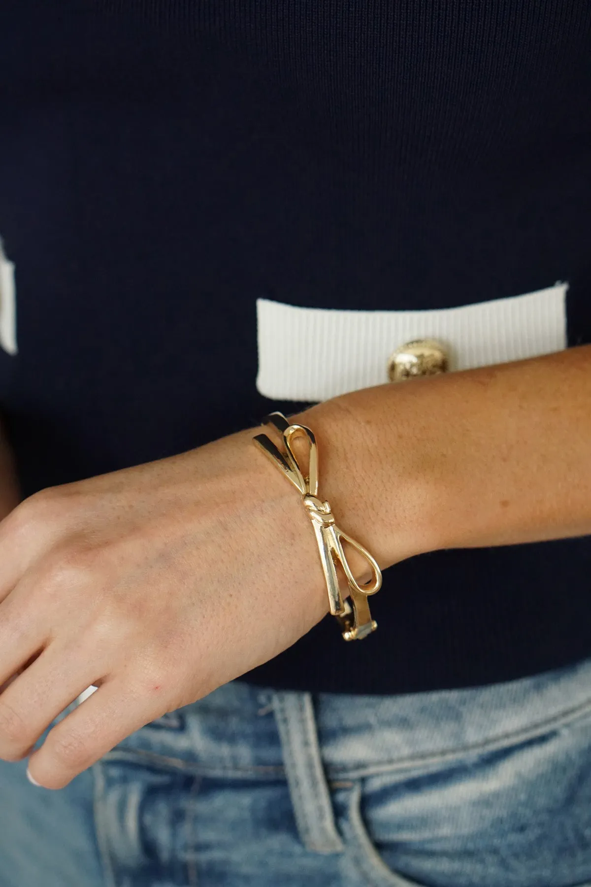 Karina Bow Wrapped Hinge Bangle in Shiny Gold sold by Canvas Style product image thumbnail 2