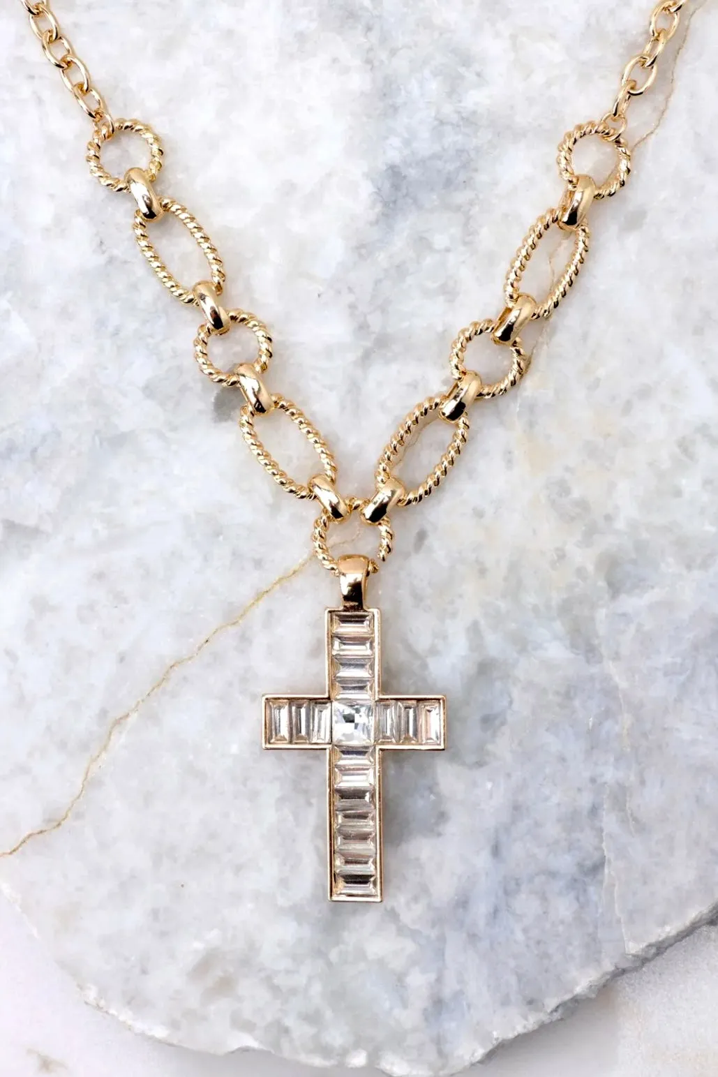 The "My Faith" Gold Cross Necklace sold by Glitzy Bella