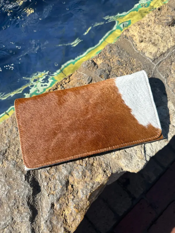 AS SEEN ON WEST DESPERADO!! Cowhide Brindle Clutch sold by Glitzy Bella