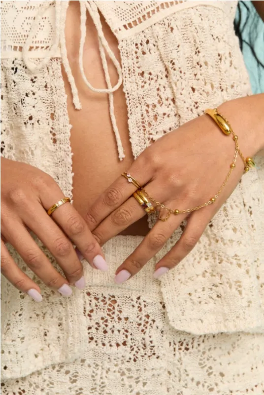 NEW!! Sol Hand Chain in Gold sold by Glitzy Bella