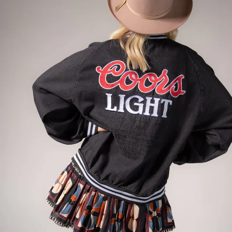 LICENSED!! The "Coors Light" Official Denim Bomber Jacket sold by Glitzy Bella